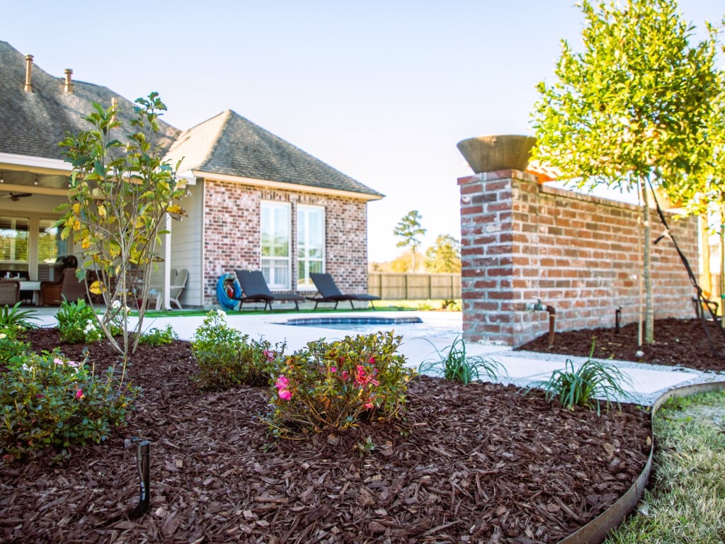 Irrigation work in a landscape bed